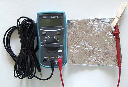 Cable, multimeter and aluminium foil.